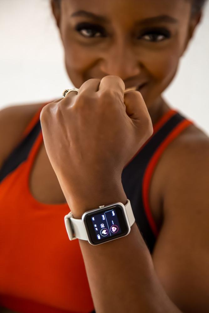 A woman showing her sports watch